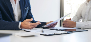 Agent man presentation and consulting car insurance detail to customer and waiting for his reply to finish.