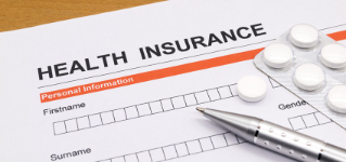 health insurance application form with sthetoscope and pen and medicine