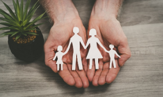 Hands protecting a family; symbol of life insurance