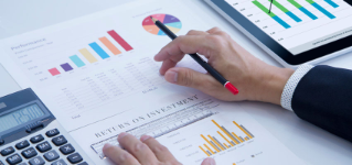 Businessman is deeply reviewing a financial report for a return on investment or investment risk analysis.