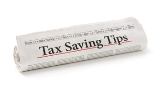 Rolled newspaper with the headline Tax saving tips