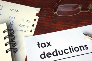 Tax deductions written on a paper. 