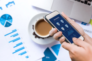 Hand holding smartphone to search for insurance online. Insurance concept