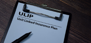 ULIP - Unit Linked Insurance Plan write on paperwork isolated on wooden table.