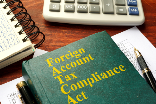 FATCA  Foreign Account Tax Compliance Act on a table.